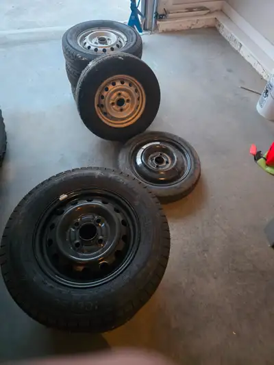 2 sets, winter / black rims and summer off road / silver rims, and 1 spare between them. $1000 for e...
