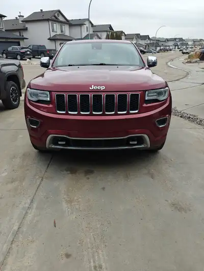 2015 Jeep Grand Cherokee Overland Color: Red with Beige Leather Interior Mileage: 245,000 km This 20...