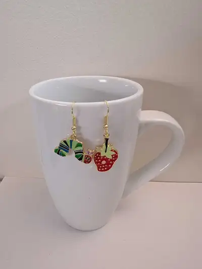 These are very cute, brand new, never been worn, The Very Hungry Caterpillar earrings. Accessorize w...
