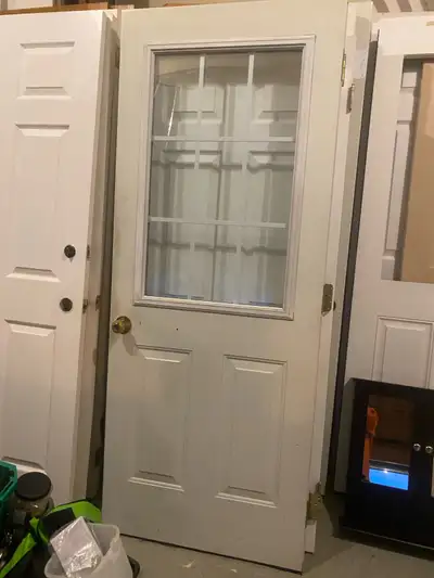 Exterior Metal insulated door with window glass insert 31.5”x79”in good condition asking $275