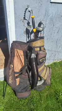 Golf clubs and 2 bags