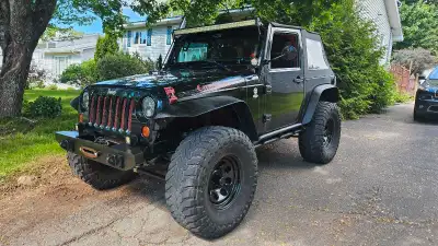 Jeep Wrangler. New MVI 09\24 -09\26 Great shape, great kms. Manual shift, crank windows, basic radio...