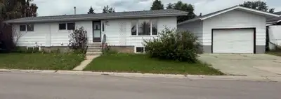 5Bedroom 4 Bathroom home with a developed basement suite , large deck and garage for sale only 35 mi...
