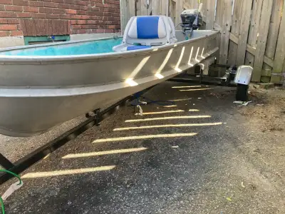 11 foot aluminum boat Evinrude 6hp motor, runs great Fuel can Anchor with 250’ rope Two new swivel s...