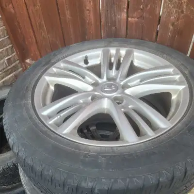 4 rims with used tires tires not in best condition. 514 291 7909