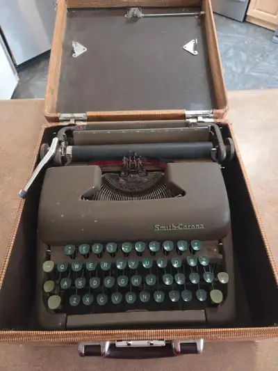 Vintage 1950s smith-corona typewriter with carry case, View more