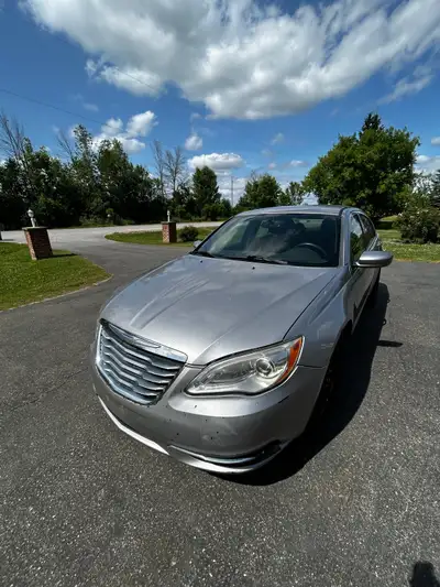 2014 Chrysler 200. Looks like a nightmare, drives like a dream. 4 door sedan with Bluetooth, automat...