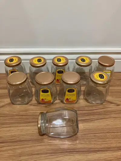 Lot of matching glass jars with lids, View more