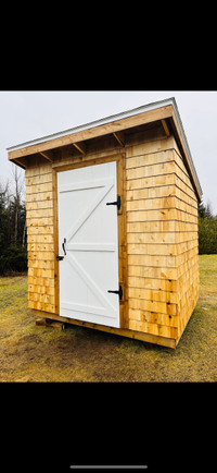 Beautiful 6x8 cedar shake shed with barn door and high roof 