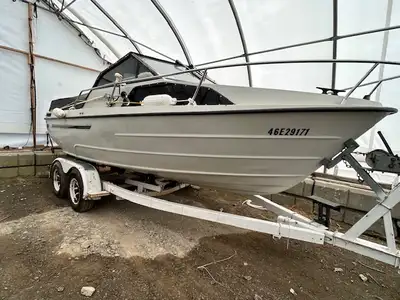1987 20’ KMV double cabin cruiser and tandem axle trailer with surge brakes. - 4.3 OMC Cobra outdriv...