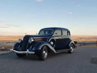 A fully restored 1935 Dodge sedan with modern upgrades is a striking blend of pre-war elegance and c...