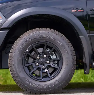 Ram Classic 5 lug rims for Warlock / Rebel With Yokohama Geolander AT LT265/70R17 3 peak mountain sn...