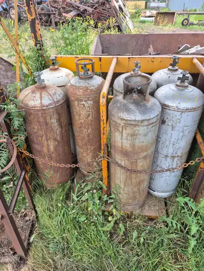 Selection of older 100 lb propane tanks. Likely no longer certified, but most propane truck will sti...