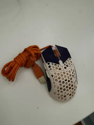 Selling my Glorious Model O gaming mouse, known for its lightweight design and honeycomb shell, offe...