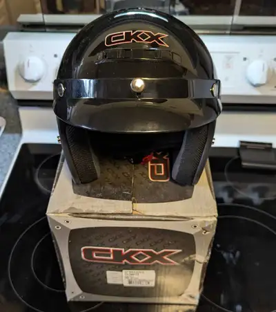 I'm selling a CKX helmet, perfect for motorcycle or snowmobile riding. This helmet is new never worn...