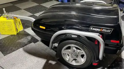 This is a Lugg & Roll motorcycle trailer. A well made and flashy looking trailer with mag wheels and...