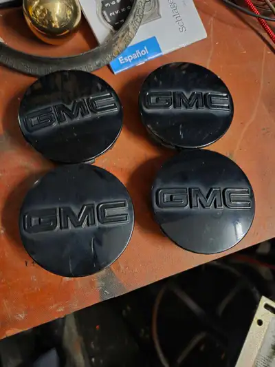 Black and gloss GMC center caps 83 mm. Came off a set of 20-inch rims on a GMC Sierra elevation. Can...