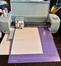 Cricut explore air 2 with lots of vinyl and blades 
