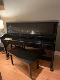 Bladwin upright piano, black ebony