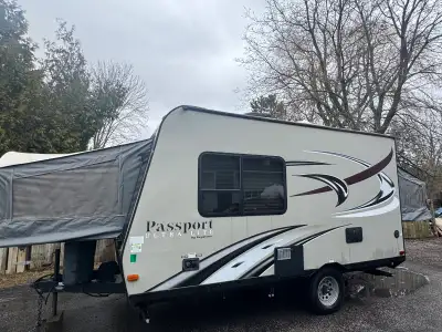 Selling a 2016 passport 145exp ultra lite hybrid 14.5 feet travel trailer, it's equipped with ac, he...