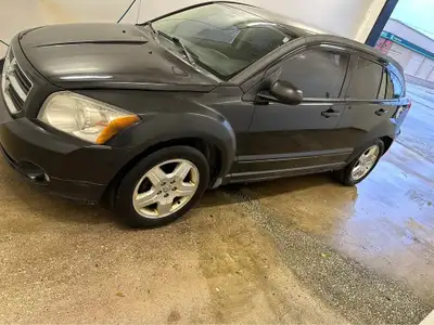 2009 Dodge Caliber has small exhaust leak runs great, 150,000 click, low KM non smoker, no accidents...