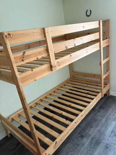 This sturdy IKEA MYDAL bunk bed frame, crafted from solid natural pine, is the perfect space-saving...