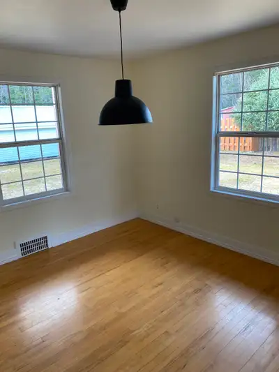 Older character home with big windows (updated) and hard wood floors. Backs onto forest. Bright warm...