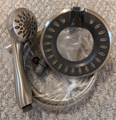 Dual Wall Mount Fixed and Handheld Shower Head in Brushed Nickel. I forgot the model #. I like it bu...