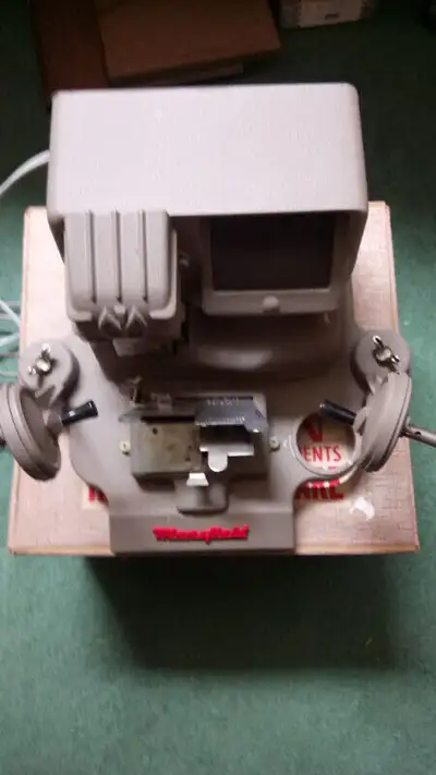 Unit is in the original box, with several spools. Excellent condition.