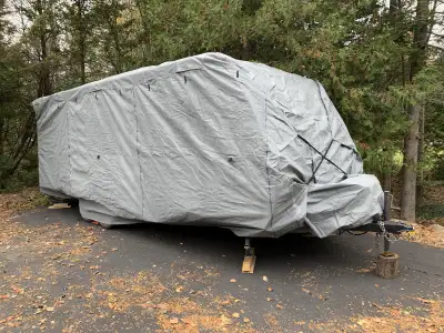 RV trailer cover. Small rip by a wheel other than that excellent condition. Has repair patches in ba...