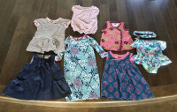 Collection of designer infant clothes. 