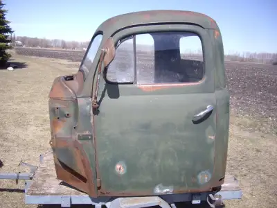 Original bare truck cab and drivers door for a 1948-52 Merc/Ford. It's in good condition, needs work...