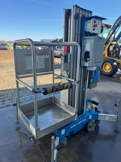 Very Light Genie man lift that can reach up to 30 ft high, Its manually push to where you want it, s...