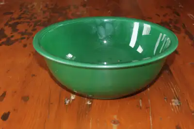 Hi. I have a vintage green pyrex bowl for sale. It has a clear bottom. The bowl shows some wear and...