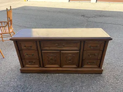 160$ 63 inch by 18 inch (32 inch high) A used sturdy wooden dresser with multiple drawers and two ca...