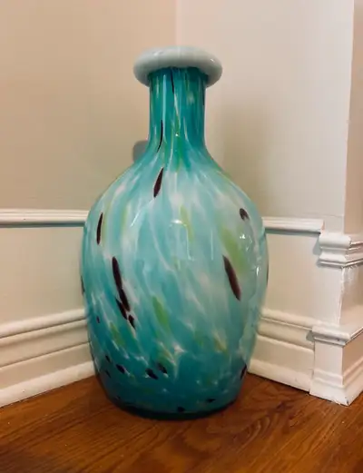 Beautiful floor vase from Pier 1 Imports. Teal with hints of brown, green and white. Add a touch of...