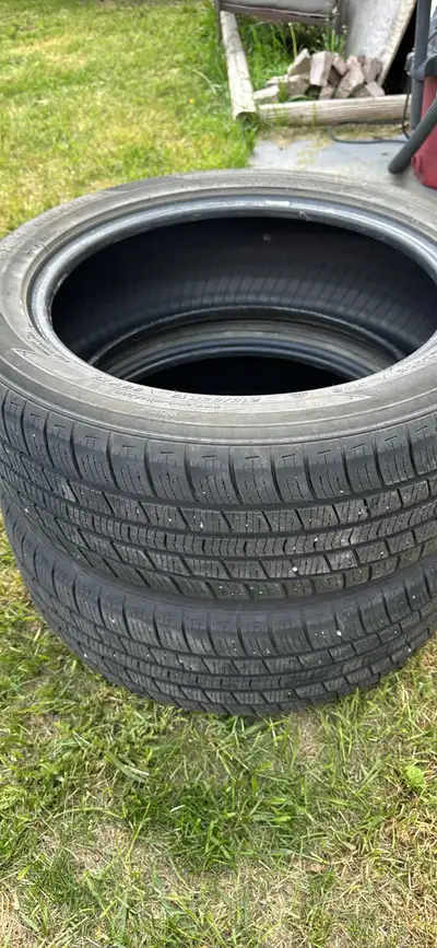 These are a pair of pre-owned 215/55R18 Omni United tires, ready for their next journey on the road....