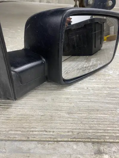 One used passenger side mirror for 2016 Dodge Ram