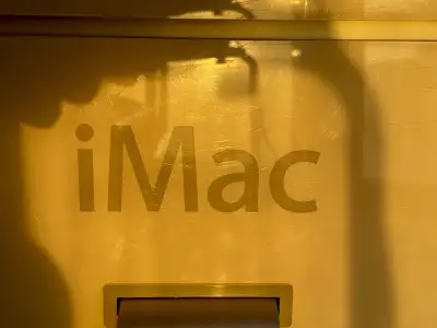 This is an older, used Apple iMac desktop computer, known for its iconic design and reliable perform...