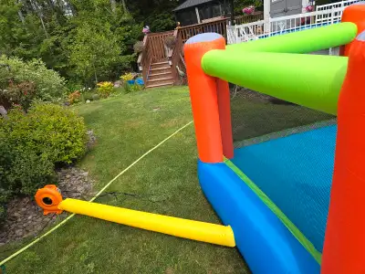 Kids bouncy castle and blower .New only set up for pictures.200.00