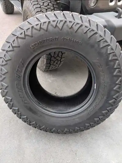 Set of 5 AMP Terrain Attack A/T A Size 315/70R17 Winter rated 4 tires used and one is new (spare)
