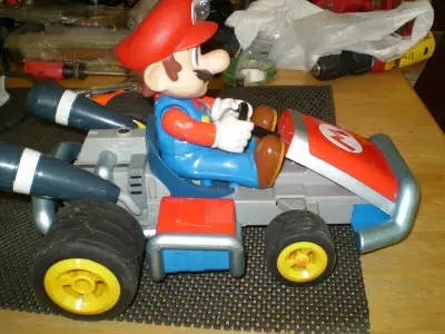 13 inch long. No controller. Complete with batteries and battery door. Scratch on right arm. Mario l...