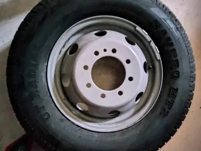 A brand new dually rim and truck tire, 225/75R16, kept as a spare for a Ford E350 dually, but never...