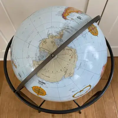Purchases in Ottawa at World Of Maps 16" globe model Blue ocean globe with a graceful metal stand. S...