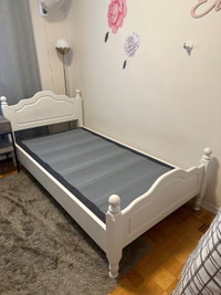 White twin sized wooden bedframe 