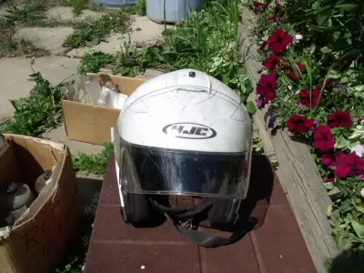 White large size helmet. Has visor and sun shield.