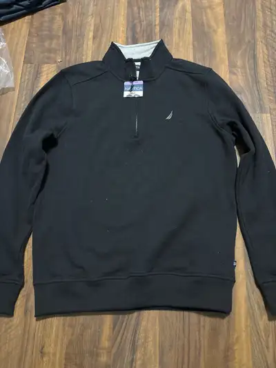 This is a new Nautica pullover, size extra small. It's a stylish and comfortable addition to any war...