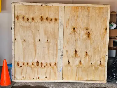 Custom-built framed plywood box for shipping a painting a long distance via a courier service. This...
