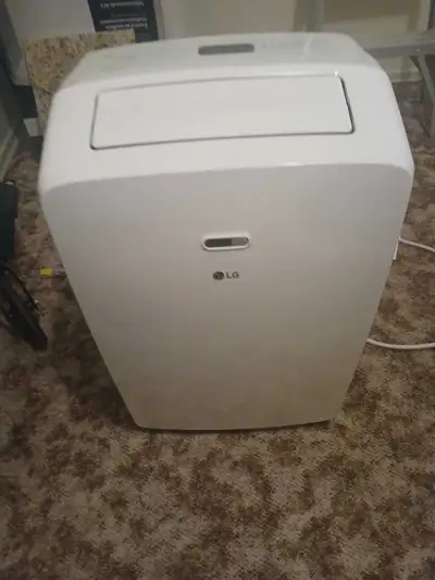 Keep cool this summer with this LG portable air conditioner, which efficiently cools small to medium...