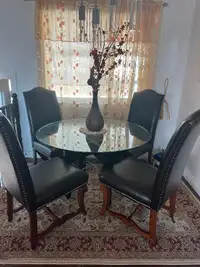 Gorgeous dining set with glass top table and 4 leather chairs
